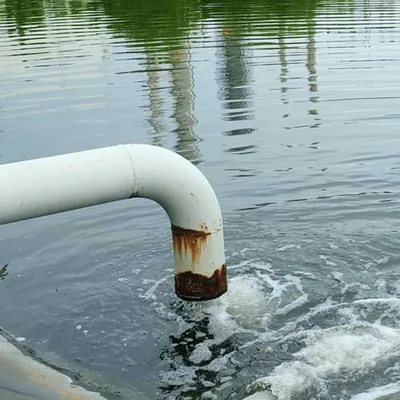 Treated effluent discharging to an outfall channel